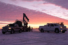 Well drilling truck at sunrise