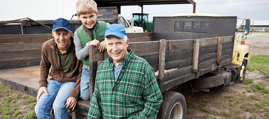 Farmers on their work truck