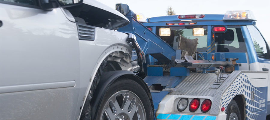 Vehicle Being Hauled by Tow Truck