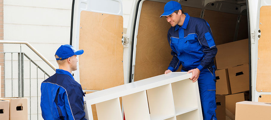 Men moving furniture out of a delivery van