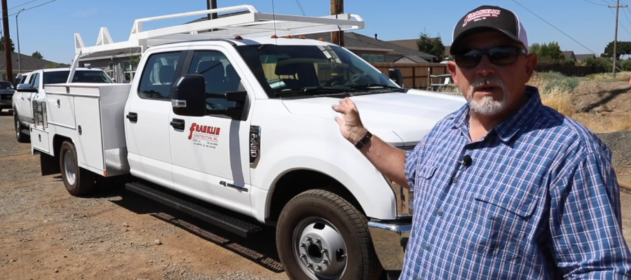 General Contractor Pointing to Work Truck with Service Utility Body