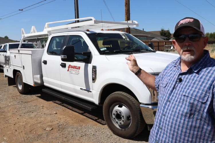 General Contractor Pointing to Work Truck with Service Utility Body