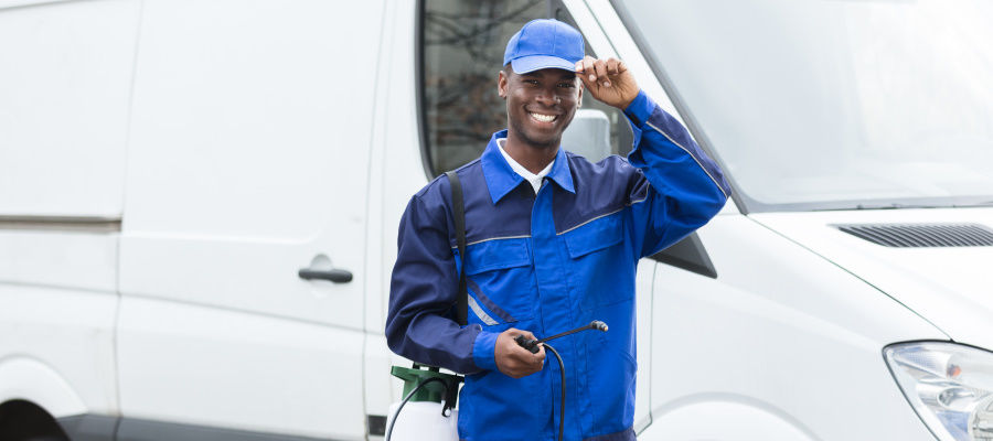 Pest Control Technician with a Work Van