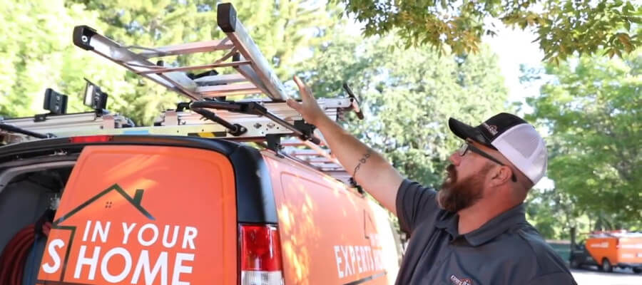 Plumber with drop down ladder rack
